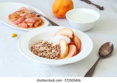 Oatmeal With Yogurt And Caramelized Peach Slices On A White Background