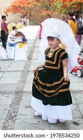 Oaxaca De Juarez, Mexico; 05-15-10: Girl With Regional Mexican Costume From Tehuana And Headdress, Belonging To The Zapotec Ethnic Group That Inhabits The Isthmus Of Tehuantepec.