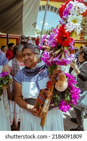 Oaxaca, Mexico - July 15, 2021: Mexican Indigenous Women Receive Tourists For The Mole Festival