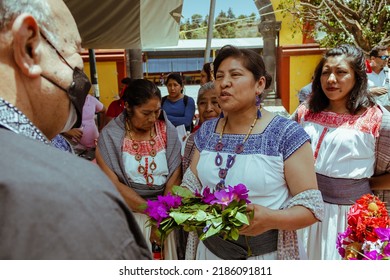 Oaxaca, Mexico - July 15, 2021: Mexican Indigenous Women Receive Tourists For The Mole Festival