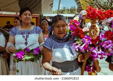 Oaxaca, Mexico - July 15, 2021: Mexican Indigenous Women Receive Tourists For The Mole Festival