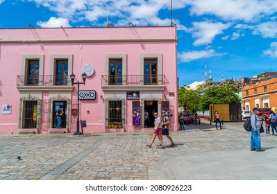 Oaxaca, Mexico - November 7, 2021 - People In Front Of Colonial Buildings With Oxxo Convenience Store