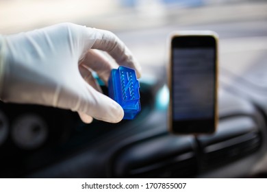 OBD2 bluetooth scanner for a car, connecting with a smartphone - diagnostics of the control unit.
