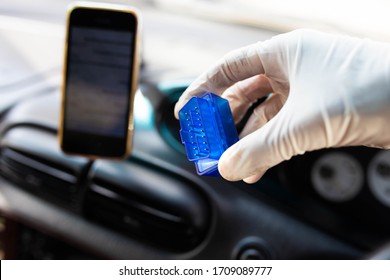 OBD2 bluetooth scanner for a car, connecting with a smartphone - diagnostics of the control unit.