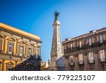 The obelisk of San domenico church and square in Naples, Italy