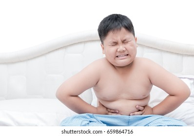 Obese fat boy overweight stomachache on bed isolated on white background, healthy concept