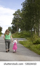 Obese Mother And Child Walking On A Forest Path On A Beautiful Summer Day.