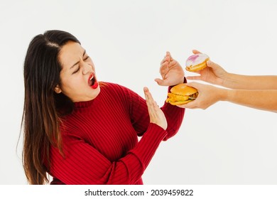 Obese Woman Didn't Want And Refused To Eat The Sweets, Hamburgers And Donuts Sent By Her Friends That Made Her Want To Lose Weight And Cut Down On Carbohydrates. With Sugar To Reduce Obesity.