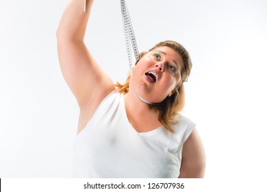 obese woman strangling herself with measuring tape