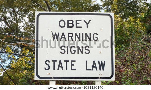 Obey warning signs State Law\
sign