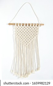 Object, macrame cotton on white background. Decorative handmade hobby interior for hanging on wall . DIY and hobby concept.