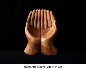 Object in my home. A wooden figure of hands during praying