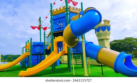 Object playground with two slides and one tube spiral slide