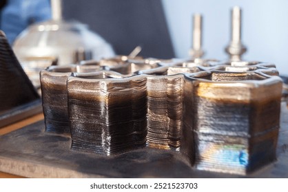 Object printed by 3D printer from metal. Additive manufacturing solution. Object created on 3Dprinter from melting metal thread. 3D Metal Printing. Metal additive manufacturing