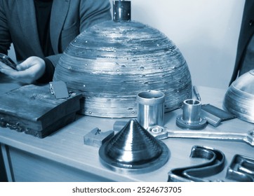 Object printed by 3D printer from metal. Additive manufacturing solution. Object created on 3Dprinter from melting metal thread. 3D Metal Printing. Metal additive manufacturing