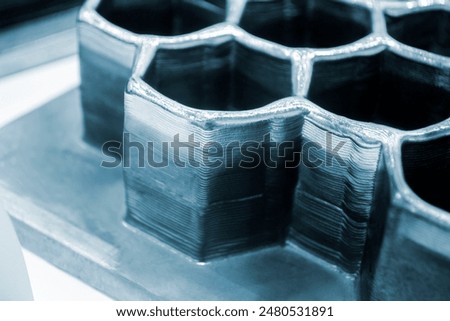 Object printed by 3D printer from metal. Additive manufacturing solution. Object created on 3Dprinter from melting metal thread. 3D Metal Printing. Metal additive manufacturing
