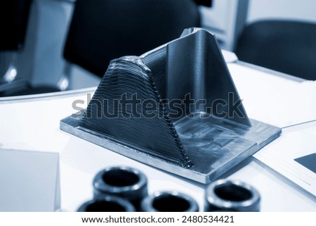 Object printed by 3D printer from metal. Additive manufacturing solution. Object created on 3Dprinter from melting metal thread. 3D Metal Printing. Metal additive manufacturing