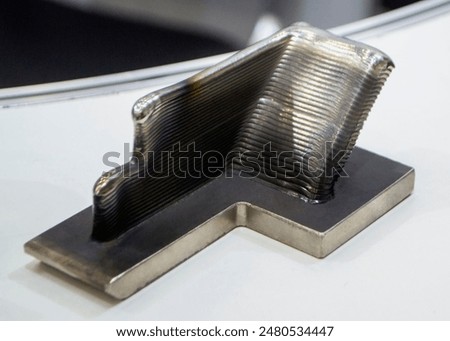 Object printed by 3D printer from metal. Additive manufacturing solution. Object created on 3Dprinter from melting metal thread. 3D Metal Printing. Metal additive manufacturing