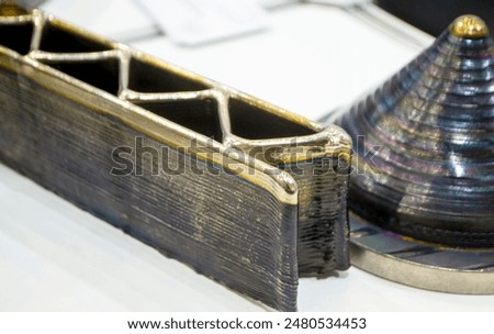 Object printed by 3D printer from metal. Additive manufacturing solution. Object created on 3Dprinter from melting metal thread. 3D Metal Printing. Metal additive manufacturing