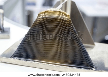 Object printed by 3D printer from metal. Additive manufacturing solution. Object created on 3Dprinter from melting metal thread. 3D Metal Printing. Metal additive manufacturing