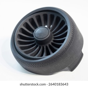 Object printed on 3D printer from melted black plastic on white isolated background. Plastic grid of round shape created on 3D printer. Small form printed by 3D printer Additive 3d printing technology
