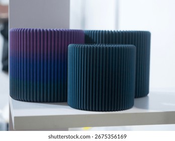 Object printed on 3D printer close up. Model printed on 3D printer from molten plastic. Vase printed on 3D printer from molten plastic of black color. 3D printing technology. Additive FDM technologies