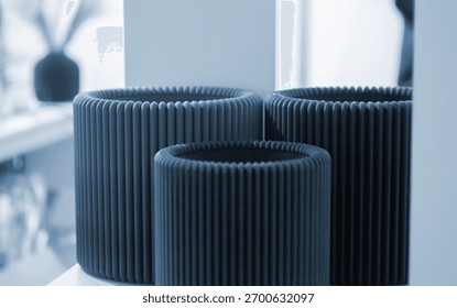 Object printed on 3D printer close up. Model printed on 3D printer from molten plastic. Form printed on 3D printer from molten plastic of black color. 3D printing technology. Additive FDM technologies