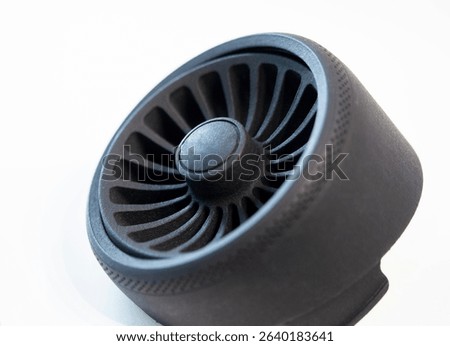 Object printed on 3D printer from melted black plastic on white isolated background. Plastic grid of round shape created on 3D printer. Small form printed by 3D printer Additive 3d printing technology