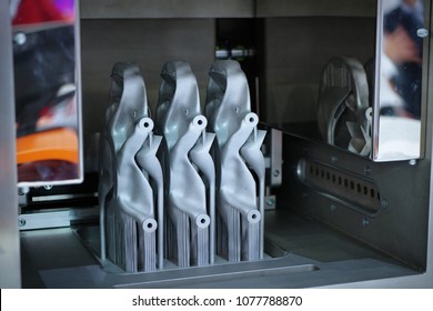 Object printed on metal 3d printer. A model created in a laser sintering machine close-up. Concept of 4.0 industrial revolution. Progressive modern additive technology.