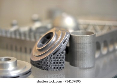Object printed on metal 3d printer. A model created in a laser sintering machine close-up. DMLS, SLM, SLS technology. Concept of 4.0 industrial revolution. Progressive modern additive technology.