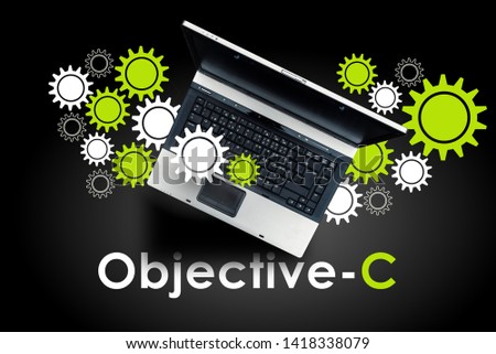  Objective-C programming language. Laptop on word Objective-C.