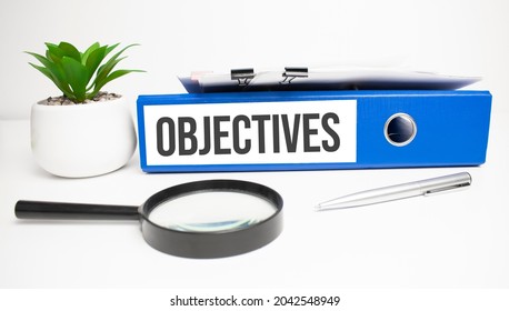 Objectives words on labels with document binders