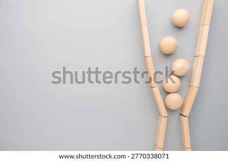 Objects constrained in a narrow passage, representing bottleneck, workflow congestion, and delays in business processes or operations