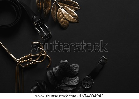 Objects luxury Flat lay on black background. Accessories and luxury hangers and belt and Luxury plants minimal.Top  view  with  copy  space. 
