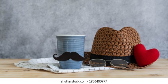 Objects On The Table Of Happy Fathers Day Holiday Background Concept.Black Mustache With Red Heart And Hat On Grey Backdrop.sign For Celebration Of Festival Daddy.mock Up, Border,banner, Copy Space