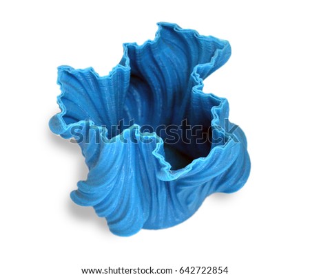 Objects printed by 3d printer Isolated on white background. Bright colorful object. Vase of blue color. Automatic three dimensional performs plastic modeling. Modern 3D printing technology.