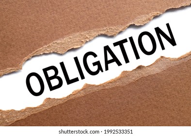 Obligations. text on torn cardboard. black letters on white paper - Shutterstock ID 1992533351