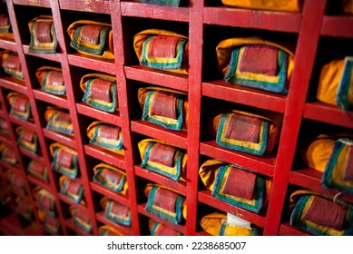 Oblique view of a colorful shelf of prayer scrolls wrapped in prayer cloths at a monastery in Karakorum, the former capital of Mongolia, Central Asia - Shutterstock ID 2238685007