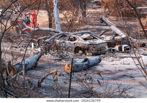 Obliterated by wildfire, property and vehicle\
sadly lost to devastating\
inferno.