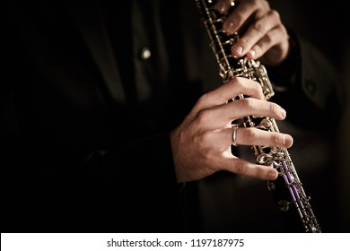 Oboe Player On Black Background