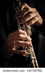 Oboe Player On Black Background