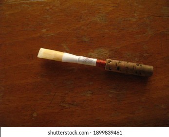 Oboe Reed On A Wooden Surface