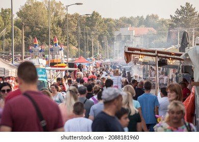 OBRENOVAC, SERBIA - SEPTEMBER 26, 2021: Selective blur on a crowd of serbs in Obrenovacki vasar, or Obrenovac bazar, a couty fair in Serbia, near Belgrade. 