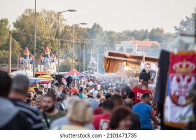 OBRENOVAC, SERBIA - SEPTEMBER 26, 2021: Selective blur on a crowd of serbs in Obrenovacki vasar, or Obrenovac bazar, a couty fair in Serbia, near Belgrade. 