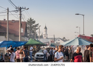 OBRENOVAC, SERBIA - SEPTEMBER 26, 2021: Selective blur on a crowd of serbs in Obrenovacki vasar, or Obrenovac bazar, a couty fair in Serbia, near Belgrade. 