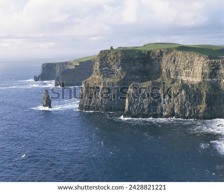 O'brians tower and breanan mor seastack looking from hag's head, the cliffs of moher, up to 230m high, county clare, munster, republic of ireland (eire), europe