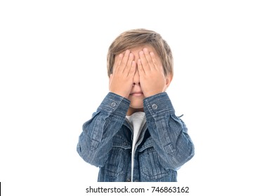 Obscured View Of Little Boy Covering Eyes With Hands Isolated On White