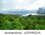 An observation deck with a very old jungle forest and blue sea. Cetti Bay, Guam