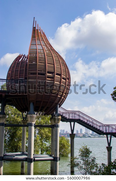 The observation point next to kingfisher pond\
in the Sungei Buloh wetland reserve Singapore, an import stop-over\
point for migratory birds. \
The background is the buildings of\
JOHOR BAHRU Malaysia.
