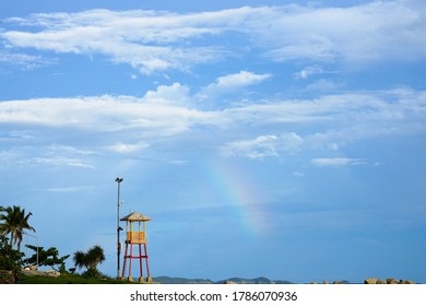 Observation Small Tower For Lifeguard With Rainbow Seaside In The Evening